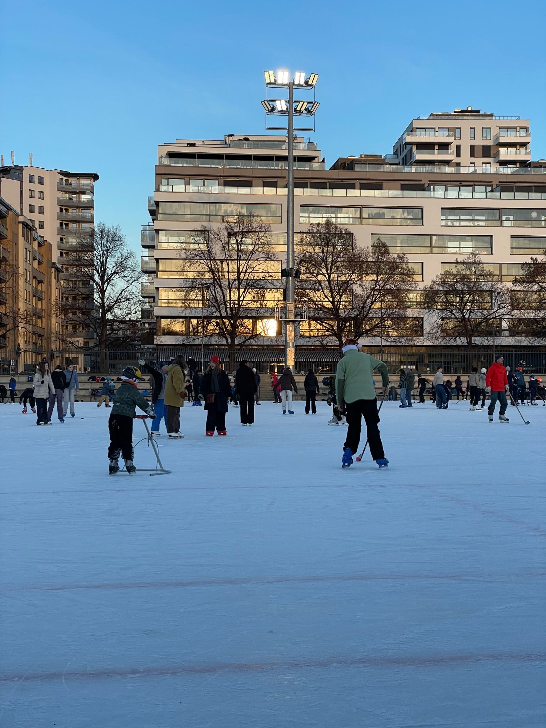 Skaters on the open-air rink at Frogner stadion in winter