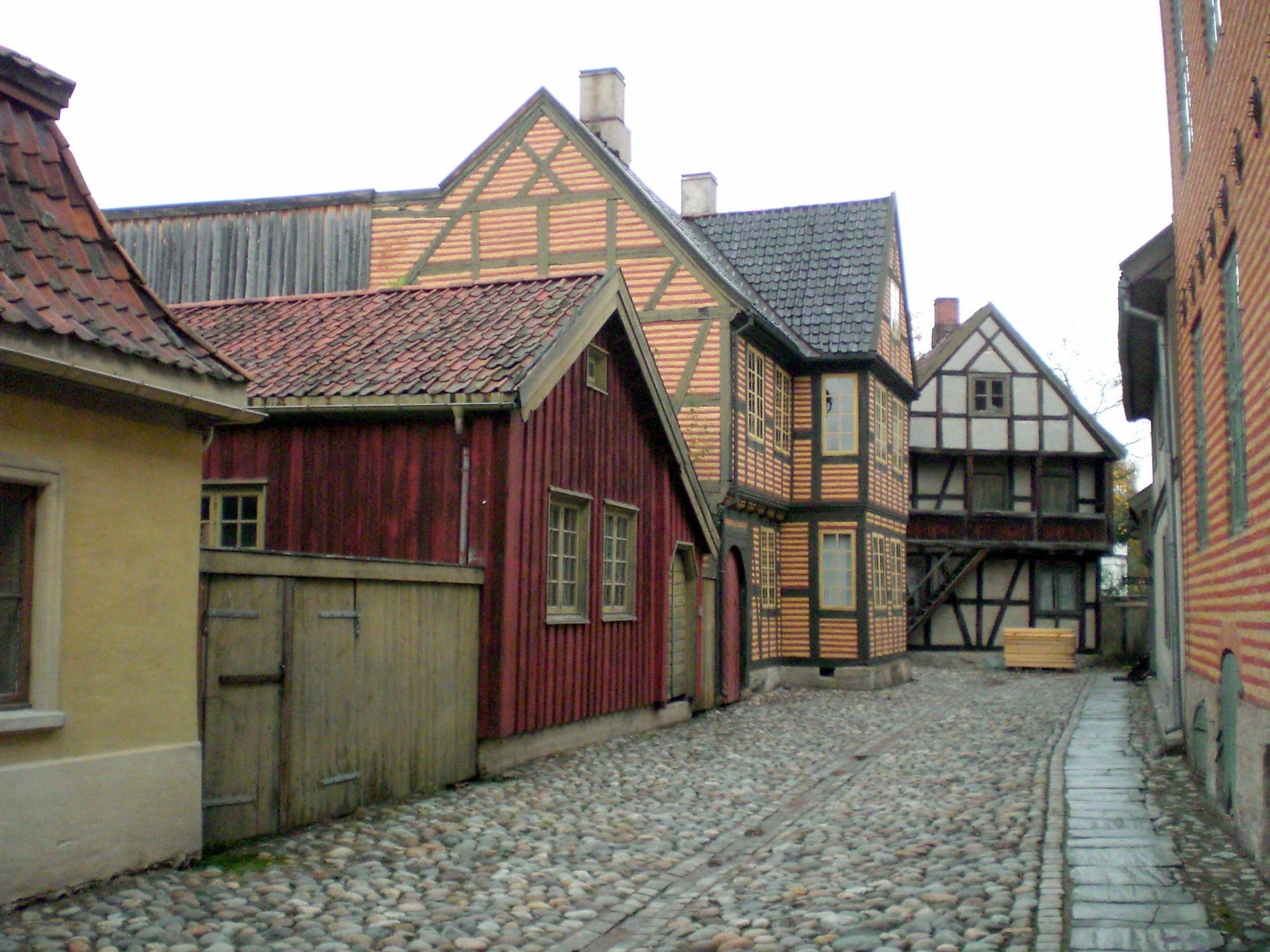Cobbled lane of historic timber houses in the open-air museum