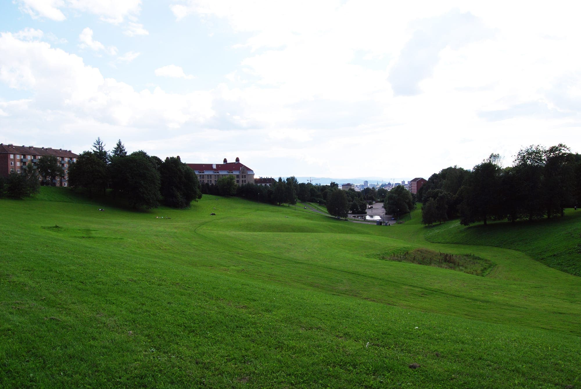 Torshovdalen's broad green valley sloping toward the city