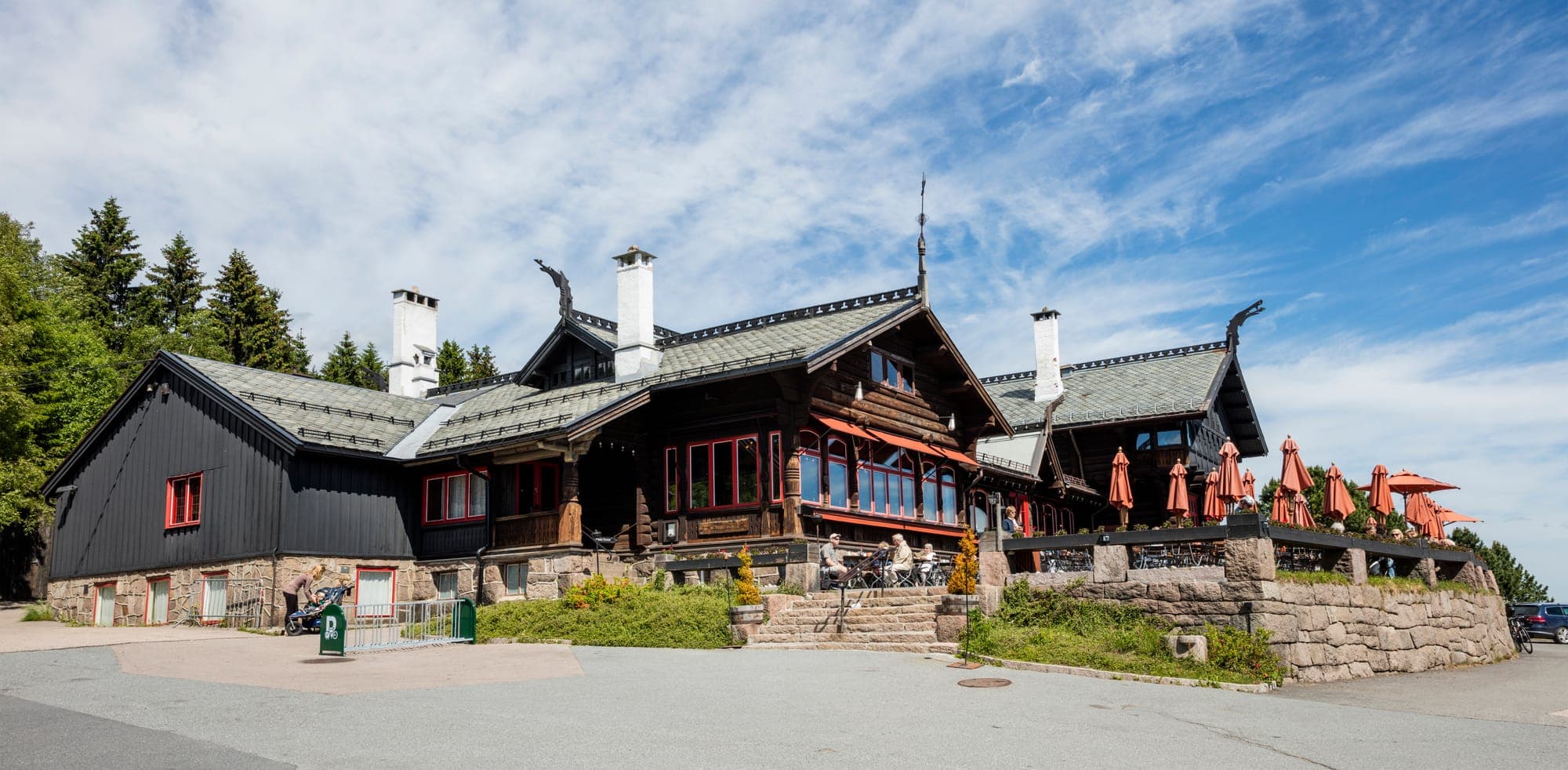 Frognerseteren's dragon-style timber lodge with carved gables and terrace