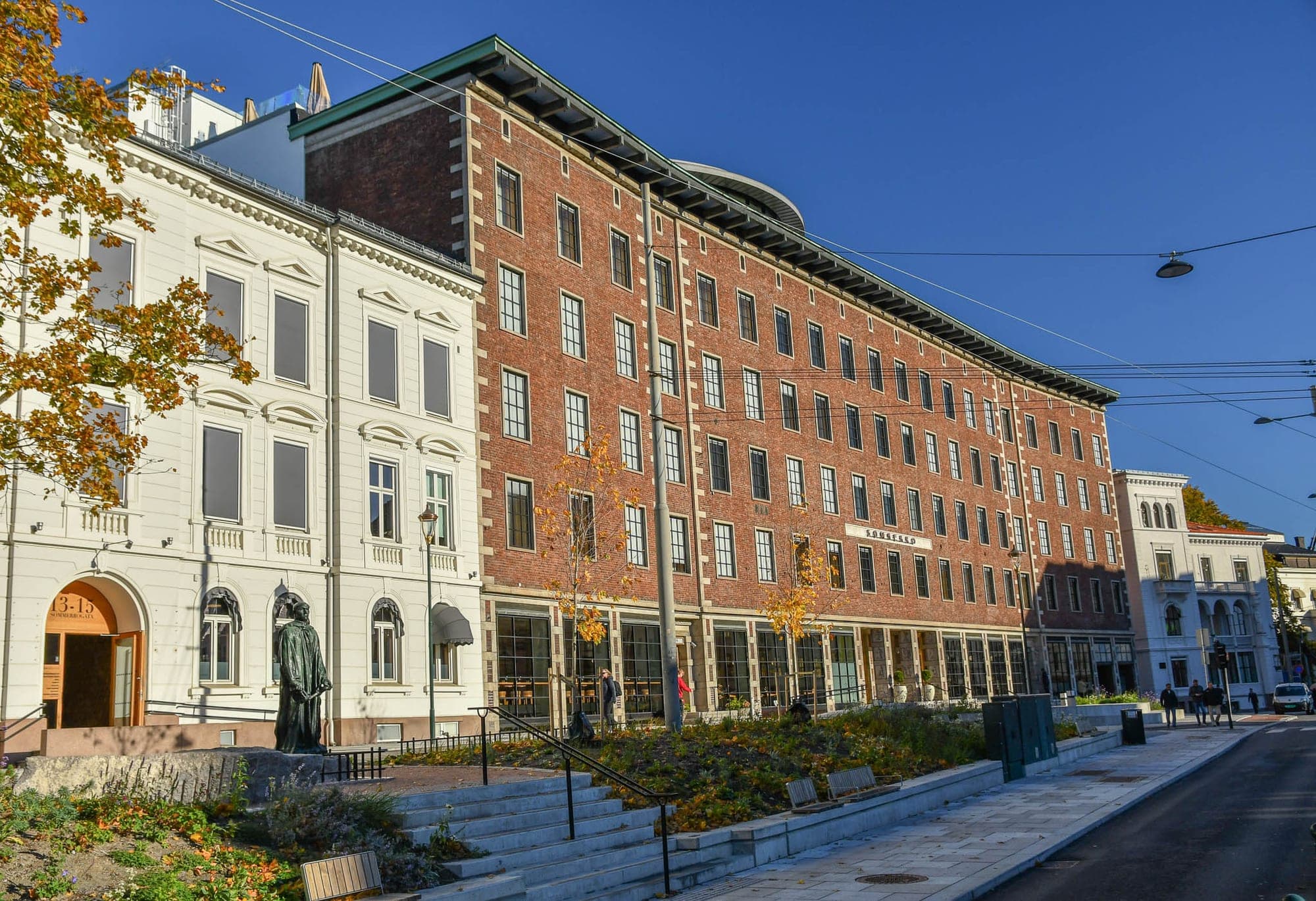 Sommerro's red-brick block seen down the street in autumn