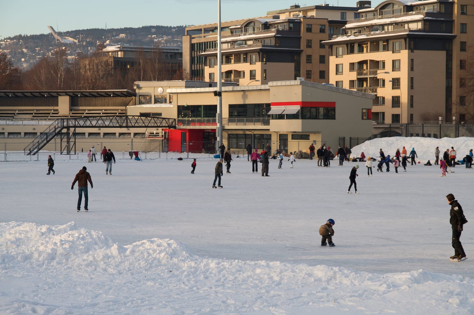 Skaters on the open-air rink at Frogner stadion in winter