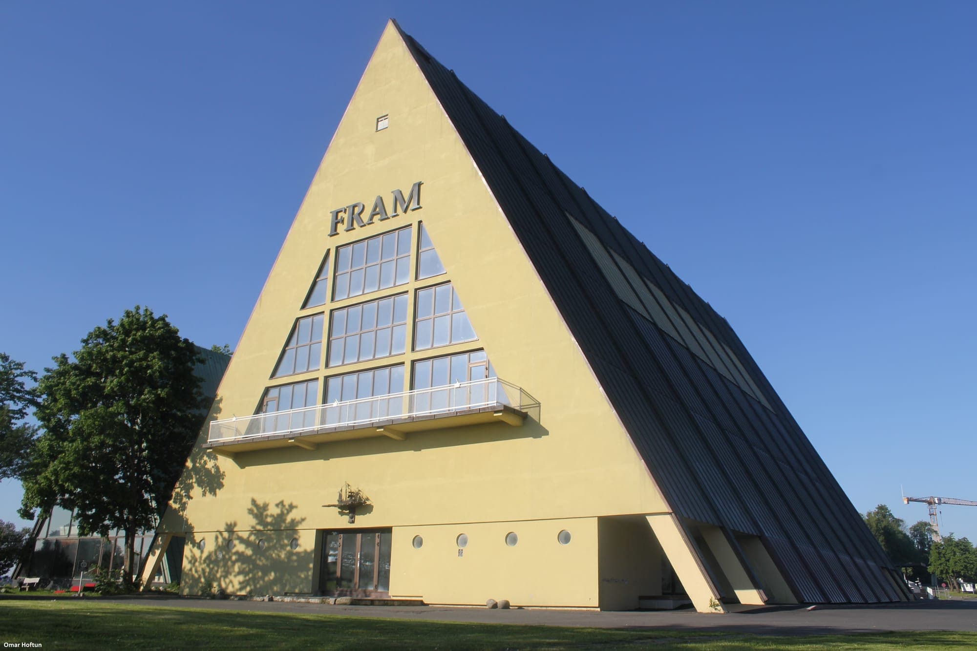 The Fram Museum's yellow A-frame against a clear sky