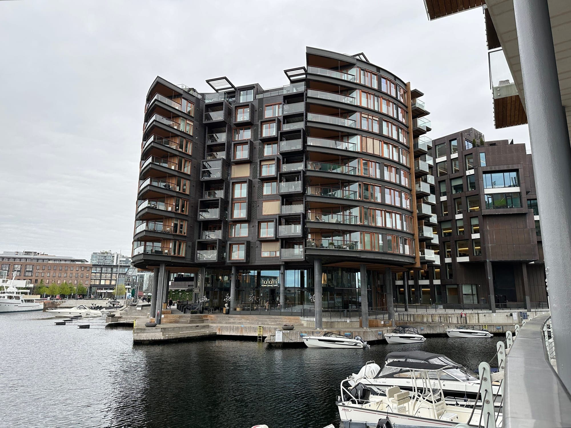 Tjuvholmen apartment block on stilts above the marina boats